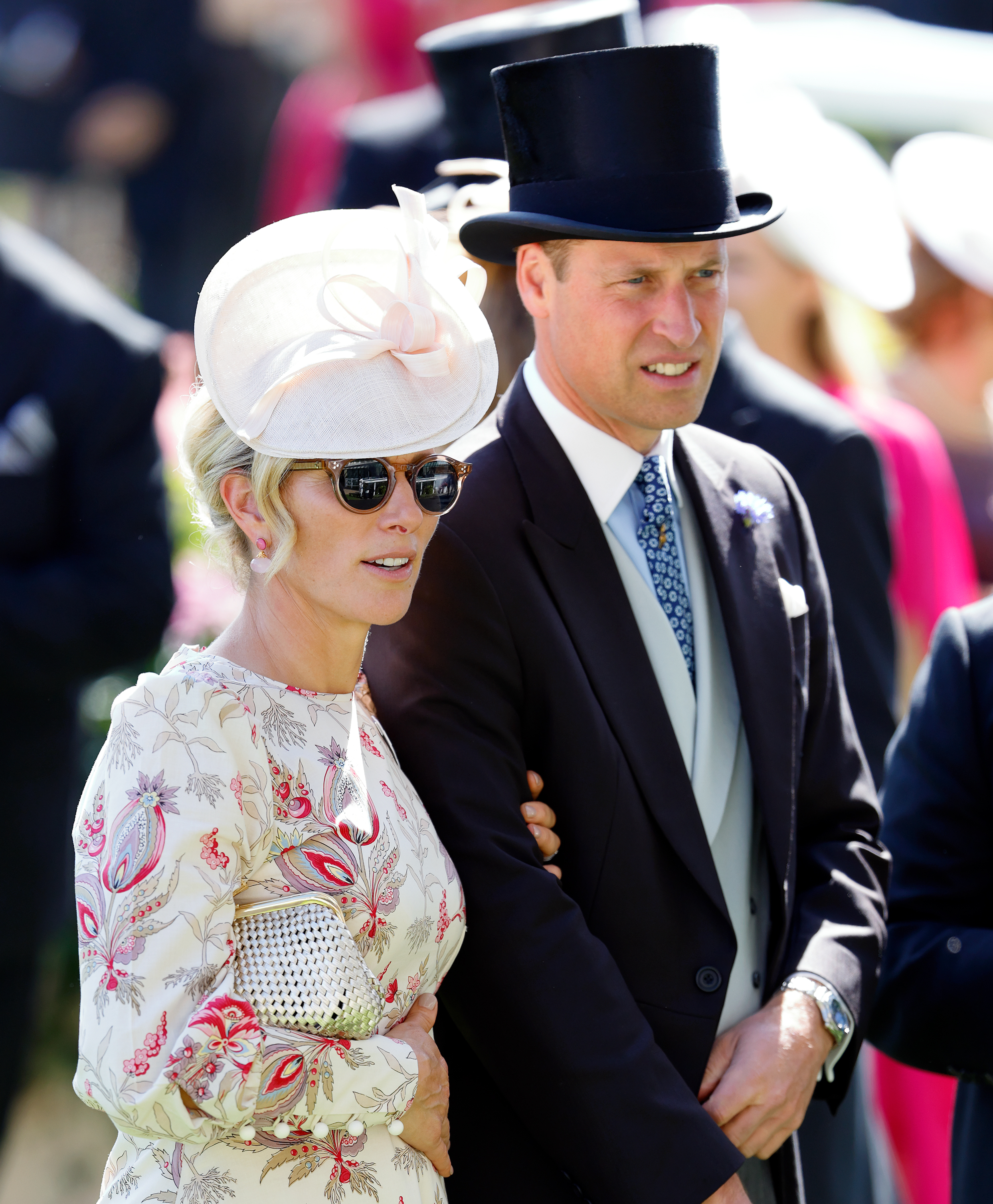 Zara Tindall wearing a white paisley dress and holding Prince William&#039;s arm at Royal Ascot