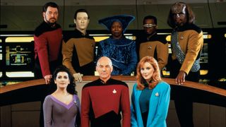 1987 crew portrait for Star Trek: The Next Generation. Pictured are from left, front row, British-American actress Marina Sirtis (as Counselor Deanna Troi), British actor Patrick Stewart (as Captain Jean-Luc Picard), and American actress Gates McFadden (as Doctor Beverly Crusher); from left, back row, American actors Jonathan Frakes (as Commander William T. Riker), Brent Spiner (as Lieutenant Commander Data), Whoopi Goldberg (as Guinan), LeVar Burton (as Lieutenant Commander Geordi La Forge), and Michael Dorn (as Lieutenant Worf).