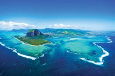 Aerial view of Mauritius from the southwest, with Le Morne Brabant peninsula and basalt monolith to the left and the &lsquo;underwater waterfall&rsquo; in the centre.