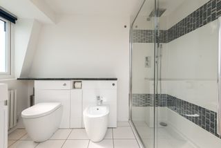 A bathroom in a mansard loft conversion space