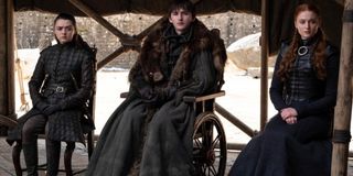 Game of Thrones Arya Bran and Sansa sitting in a row, under some shade