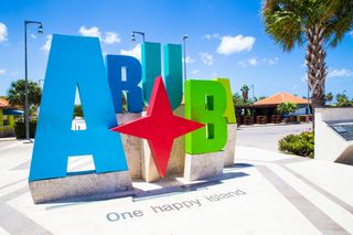 Colorful Aruba sign near the beach