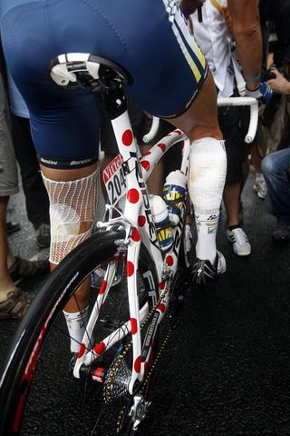 Johnny Hoogerland's legs are heavily bandaged, but he continues in the polka dot jersey