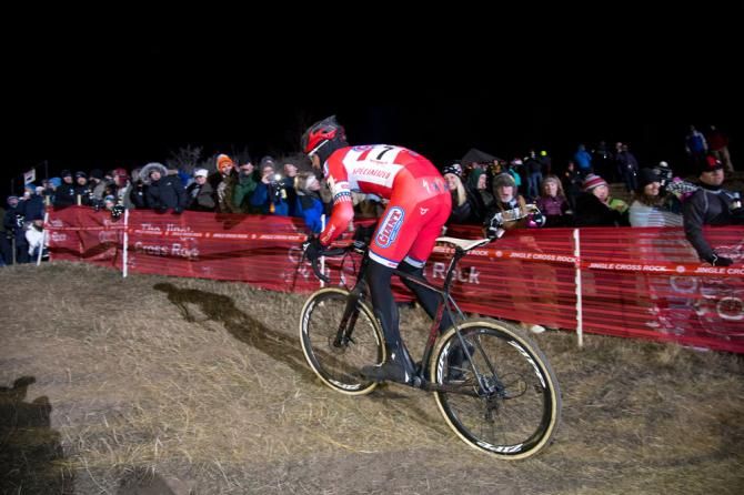 Yannick Eckmann powers up the climb with fans screaming their support.