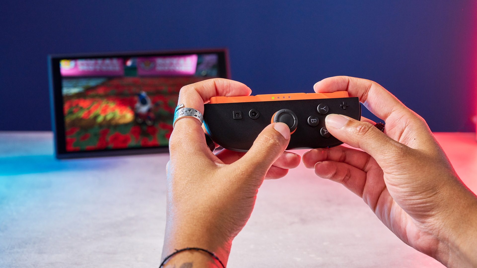 A Nintendo Switch 2 photographed under RGB lighting
