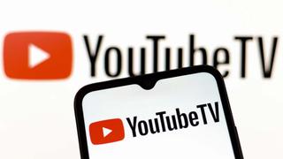 The YouTube TV logo appears on the screen of a smartphone and in the background on the computer screen in Reno, United States, on December 15, 2024. (Photo by Jaque Silva/NurPhoto via Getty Images)