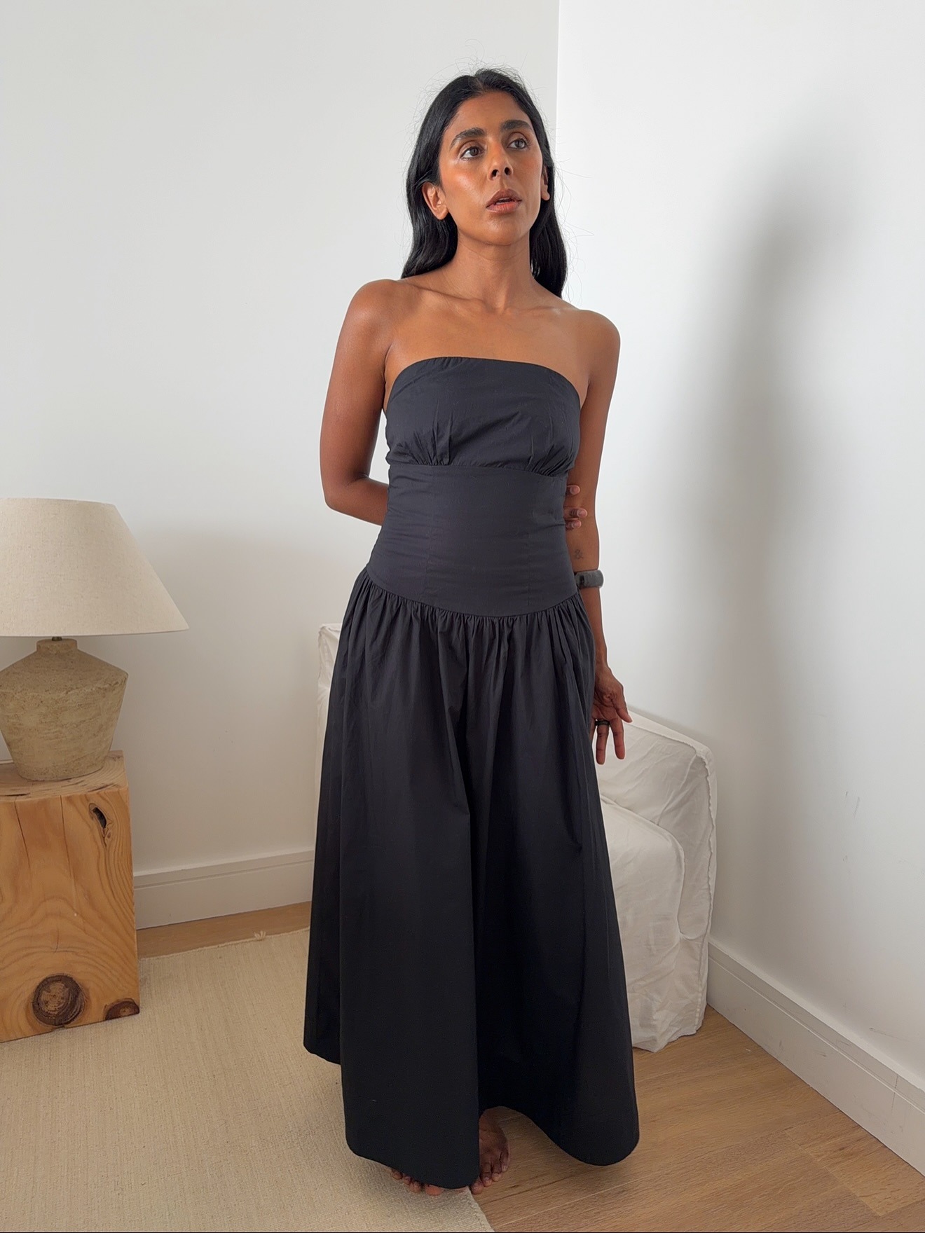 Monikh wearing strapless black dress