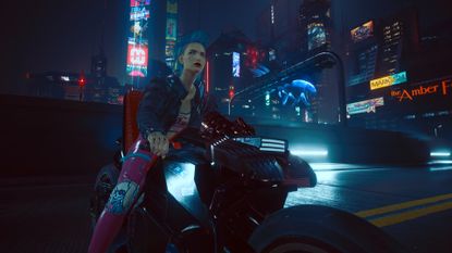 Cyberpunk 2077 screenshot of female V who has blue hair and wears pink trousers and black jacket and sits on the back of a motorcycle before neon skyscrapers 