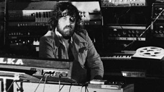 Greek composer of electronic music, Vangelis, surrounded by equipment at a venue, 28th January 1976. (Photo by Michael Putland/Getty Images)