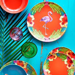 blue background with flamingo print plates