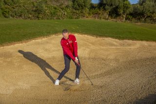 Impact shot for a greenside bunker shot