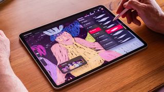 Procreate Dreams; a person uses touch controls on an iPad