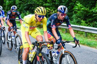 Slovenian Tadej Pogacar of UAE Team Emirates and Slovenian Primoz Roglic of Red Bull-Bora-Hansgrohe pictured in action during stage 5 of the 2024 Tour de France cycling race, from Saint-Jean-de-Maurienne to Saint-Vulbas, France (177,4 km) on Wednesday 03 July 2024. The 111th edition of the Tour de France starts on Saturday 29 June and will finish in Nice, France on 21 July. BELGA PHOTO POOL LUCA BETTINI (Photo by POOL LUCA BETTINI / BELGA MAG / Belga via AFP) (Photo by POOL LUCA BETTINI/BELGA MAG/AFP via Getty Images)