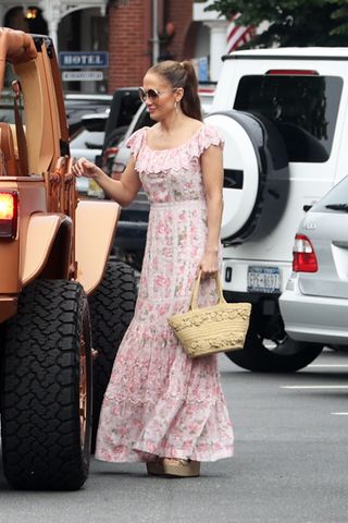 Jennifer Lopez gets into a Jeep in the Hamptons wearing a pink floral dress