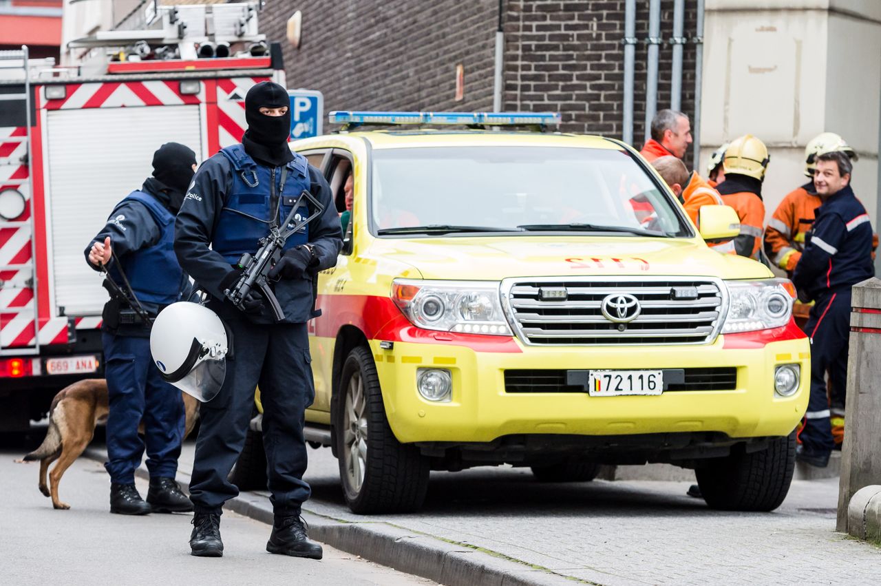 Police raid a Brussels neighborhood.