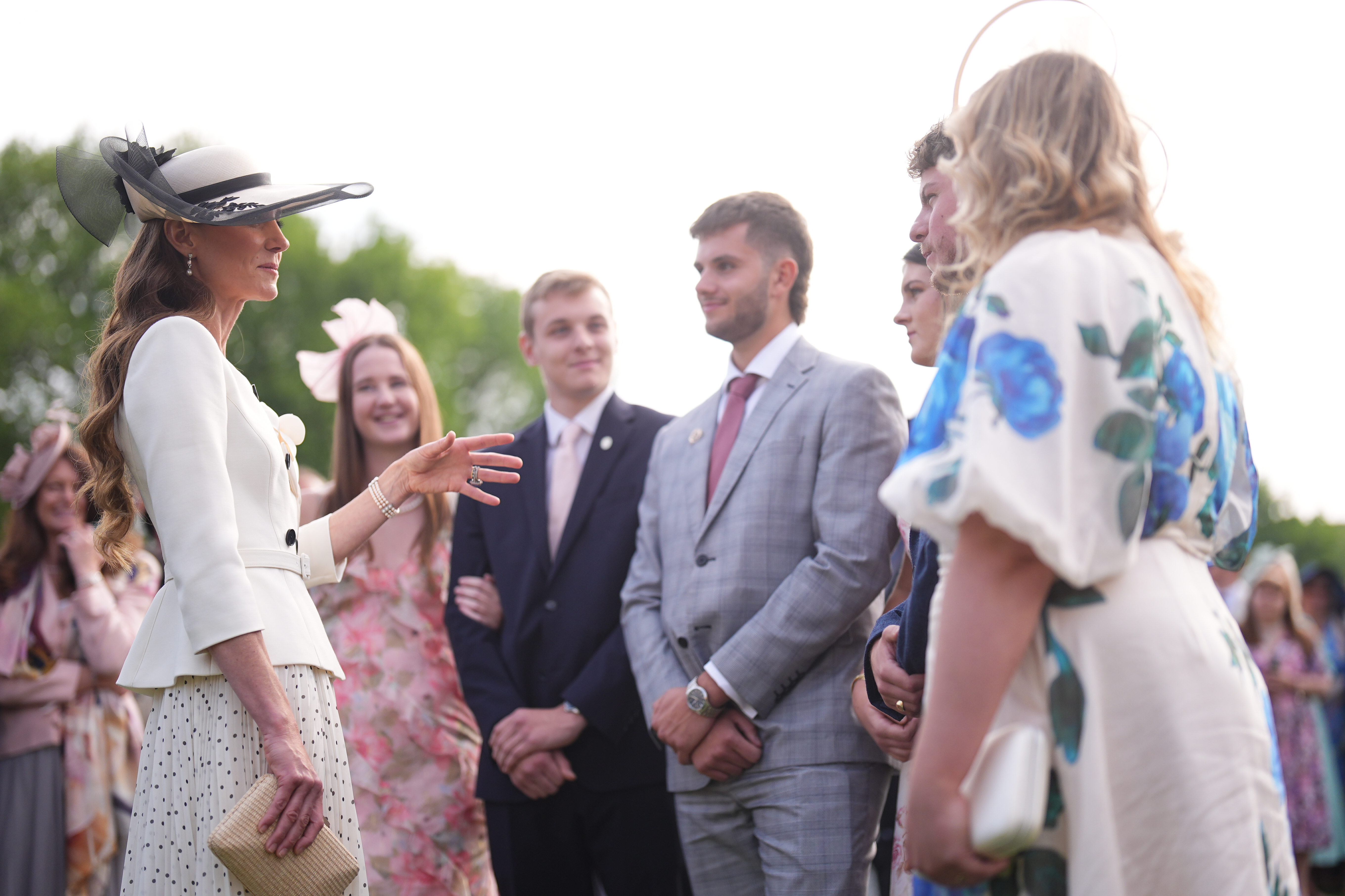 Princess Kate talking to guests at a garden party