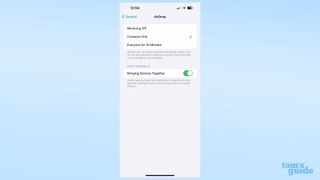 A screenshot showing the toggle to disable proximity AirDrop sharing in iOS 17