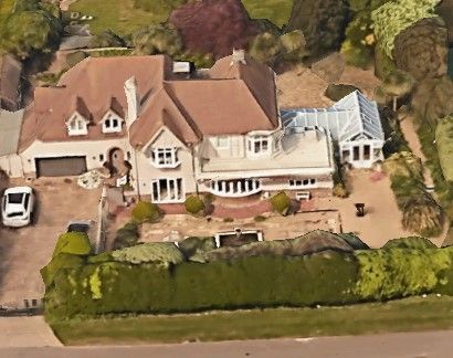 A Google Earth image of John Inverdale&#039;s house which has a greenhouse and driveway