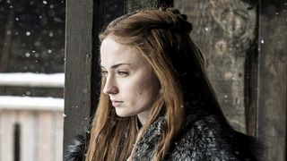Sophie Turner as Sansa Stark, looking perturbed on the balcony at Winterfell during Game of Thrones season 7