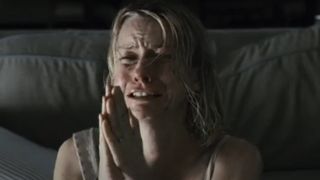 Naomi Watts pleading with her hands together in Funny Games