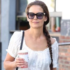 Katie Holmes styled her Franco Sarto Mary Janes with a boho top trend and wide-leg jeans