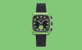 Square Seiko watch on green background