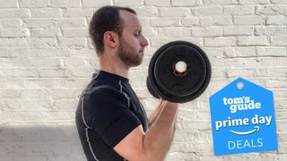 James Frew working out with dumbbells at home