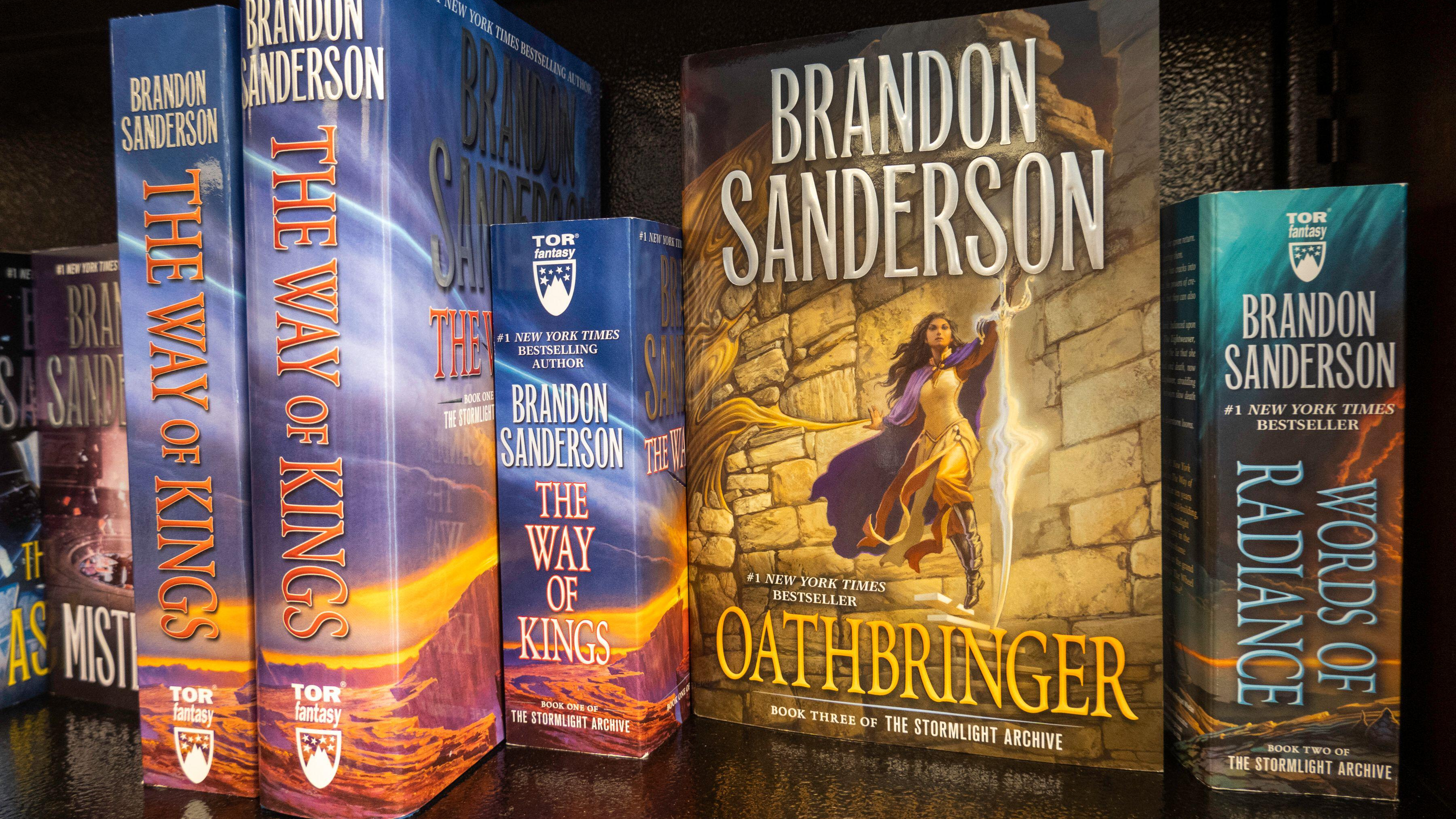 A photograph of several of Brandon Sanderson novels on a bookshelf (taken in 2021)