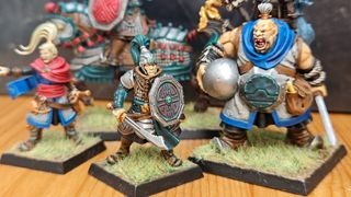 A selection of painted miniatures from the Warhammer: The Old World Grand Cathay Battalion boxed set.