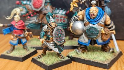 A selection of painted miniatures from the Warhammer: The Old World Grand Cathay Battalion boxed set.