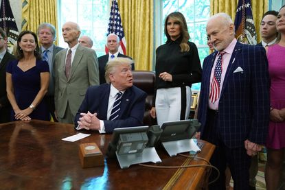 Buzz Aldrin, Michael Collins, and Donald Trump.