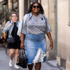Women wearing a football shirt with a denim midi skirt