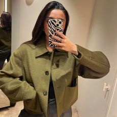Senior Shopping Editor Marina Avraam wearing a khaki COS wool jacket