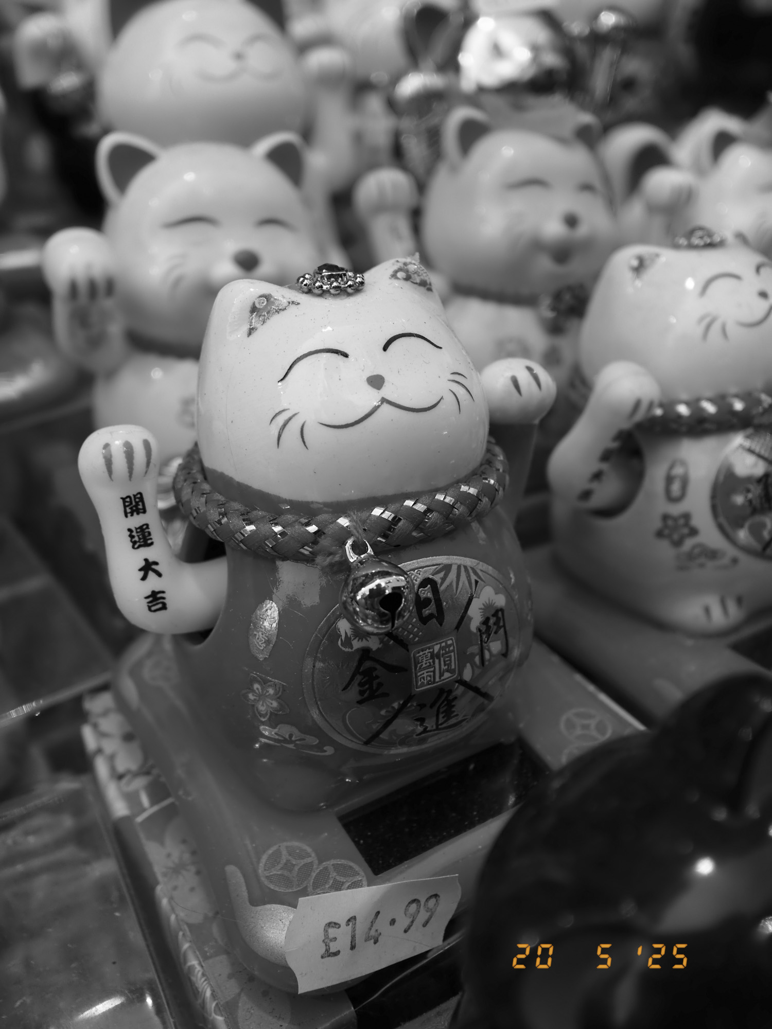 Closeup of maneki-neko in London's china town