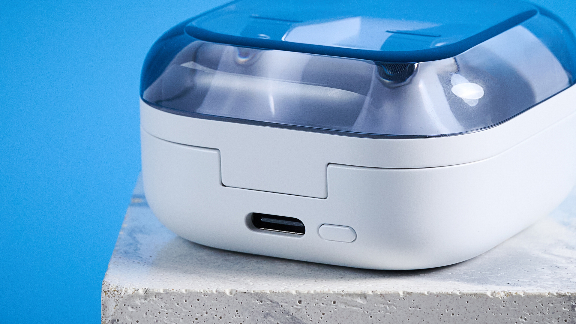 the samsung galaxy buds 4 photographed against the blue tom's guide background showing charging case and buds