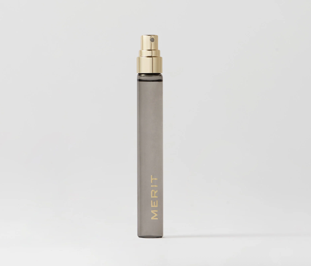 A Merit Retrospect travel fragrance bottle