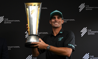 Joaquin Niemann holds the Saudi International trophy