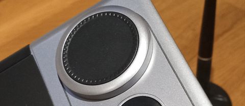 Huion Inspiroy Dial 2 review; a close up of a dial on a drawing tablet