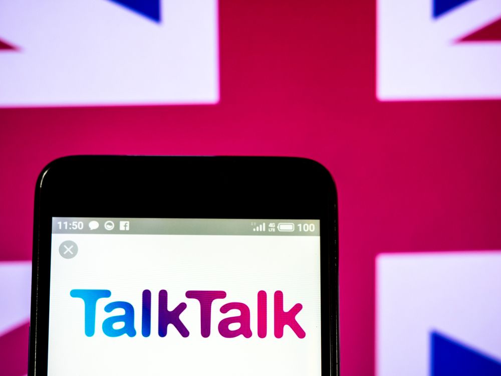 TalkTalk&amp;#039;s logo on a smartphone with a UK flag behind