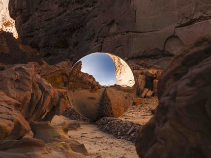 Desert X AlUla 2024 art installation, mirrored sphere in landscape