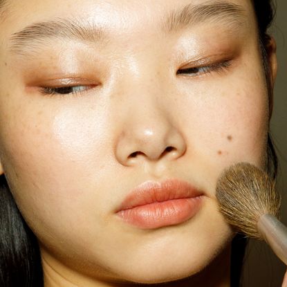 Yoon Young Bae is seen during the make up in backstage at the Ermanno Scervino Fashion Show during the Milan Fashion Week Womenswear Spring/Summer 2023 on September 24, 2022 in Milan, Italy.