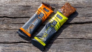A pair of Torq energy bars on a wooden bench