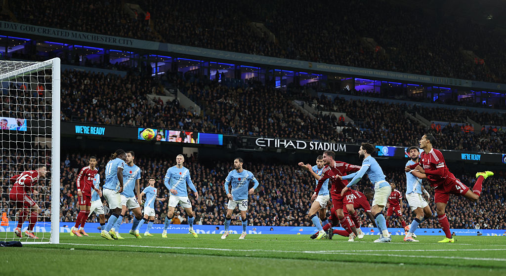 Liverpool&#039;s Dutch defender #04 Virgil van Dijk heads the ball in but the goal is dissallowed for offside against Liverpool&#039;s Scottish defender #26 Andrew Robertson (L) during the English Premier League football match between Manchester City and Liverpool at the Etihad Stadium in Manchester, north west England, on November 9, 2025. (Photo by Darren Staples / AFP) / RESTRICTED TO EDITORIAL USE. No use with unauthorized audio, video, data, fixture lists, club/league logos or &#039;live&#039; services. Online in-match use limited to 120 images. An additional 40 images may be used in extra time. No video emulation. Social media in-match use limited to 120 images. An additional 40 images may be used in extra time. No use in betting publications, games or single club/league/player publications. /