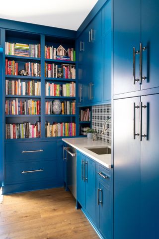 A kitchen with bookshelf