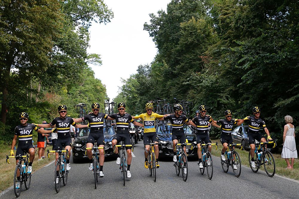 Chris Froome celebrates with his Team Sky teammates on the final Tour de France stage