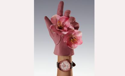 Grand Seiko Elegance SBGY026G watch with pink flower in gloved hand