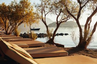 Sun loungers on the beach at Domes of Elounda