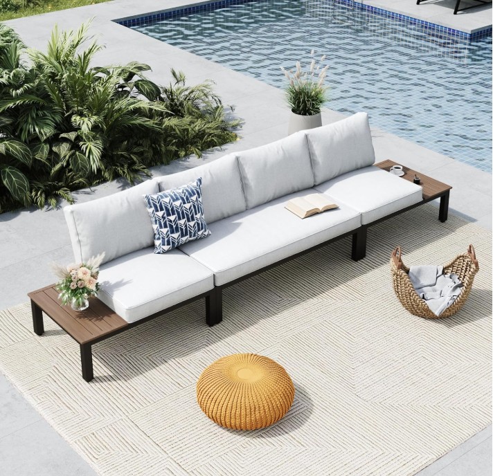 MFStudio 4-seat patio set with off-white cushions styled on a rug next to a swimming pool