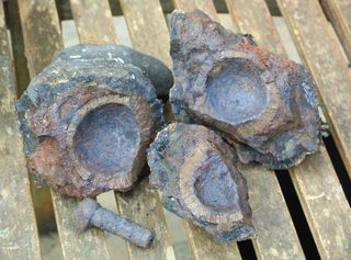 The grenade consisted of a hollow iron shell filled with gunpowder, which would have been lit by a fuse that passed through the shell.
