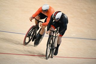 Britain's Jack Carlin and Netherlands' Jeffrey Hoogland compete in a men's track cycling sprint final race 2 for bronze of the Paris 2024 Olympic Games 